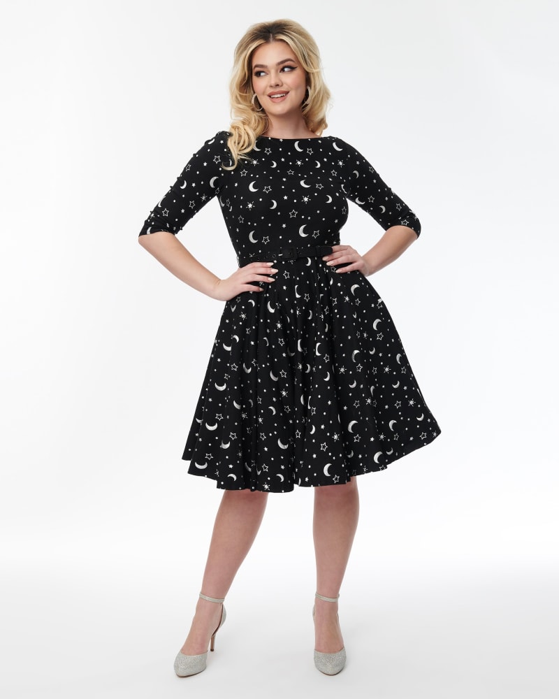 Front of a model wearing a size 4X Unique Vintage Black & Foil Moons & Stars Devon Swing Dress in Black, Stars by Unique Vintage. | dia_product_style_image_id:304989